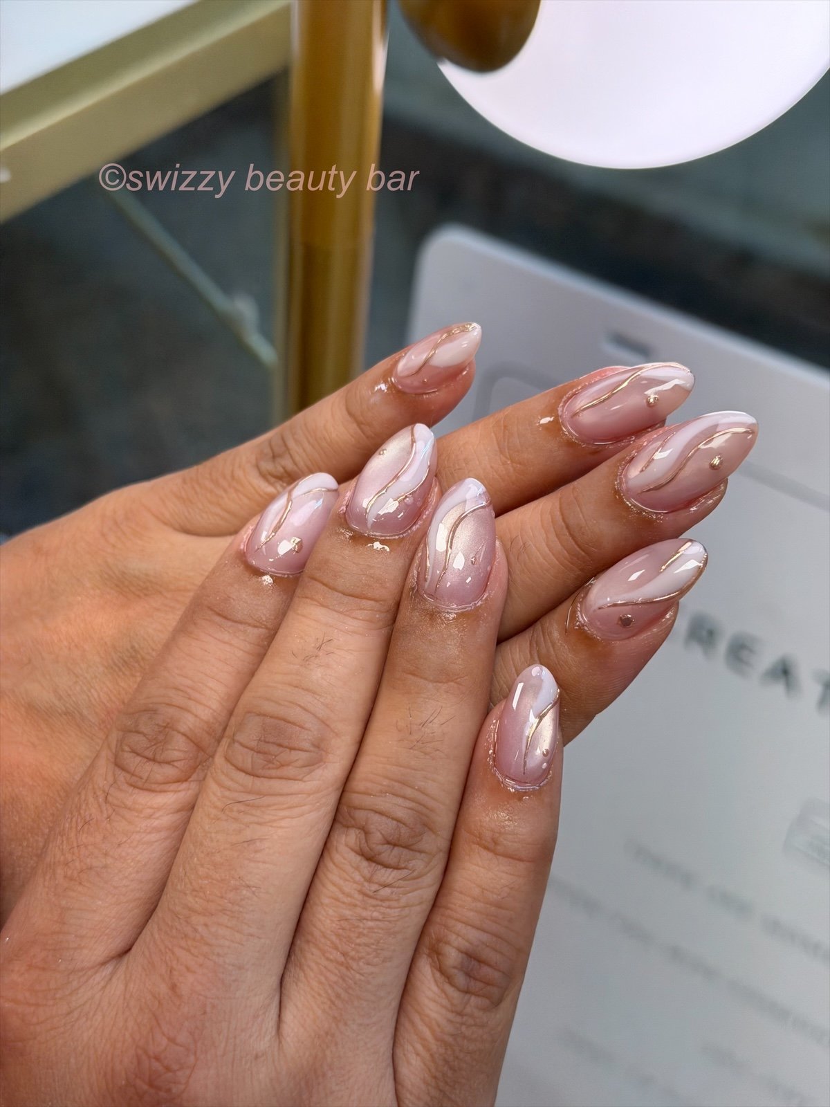 Gold Swirl nail art at Swizzy Beauty Bar, Japanese gel nails Flushing NY