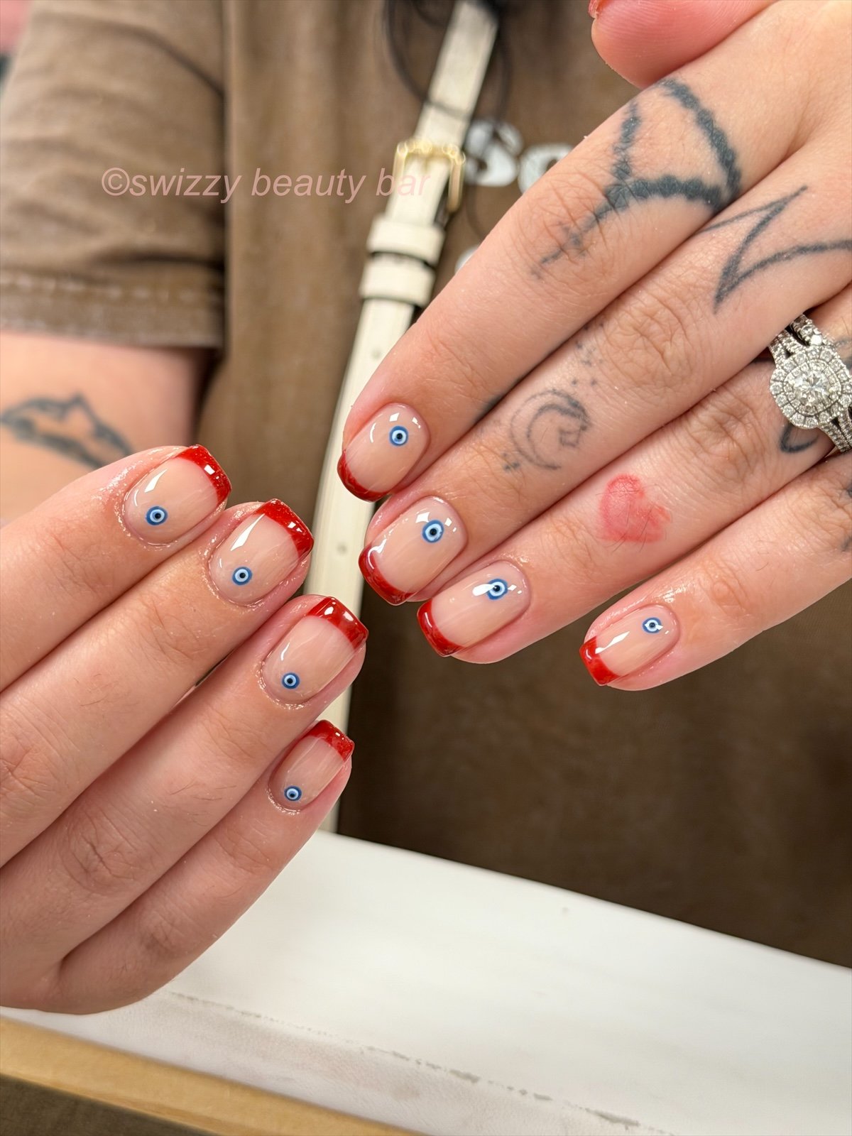 Red French Evil Eye nail art at Swizzy Beauty Bar, Japanese gel nails Flushing NY