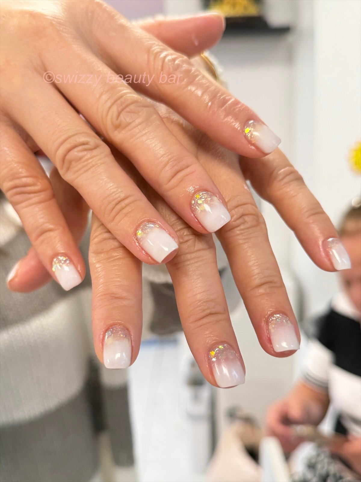 White Glitter French nail art at Swizzy Beauty Bar, Japanese gel nails Flushing NY